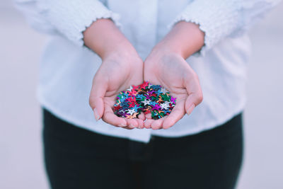 Close-up of hand holding confetti