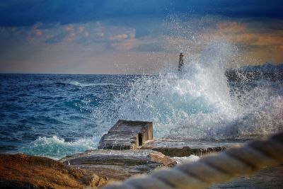 View of waves breaking on shore