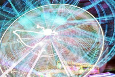 Full frame shot of illuminated ferris wheel at night