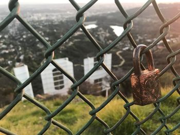 Close-up of lock on chainlink fence