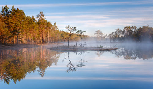 Scenic view of lake against sky during autumn