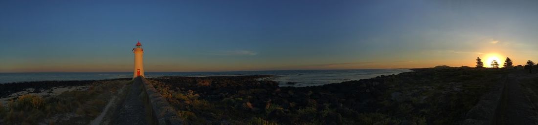 Panoramic view of beach against sky during sunset