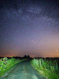 Scenic view of field against sky at night