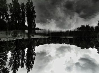 Scenic view of lake against cloudy sky