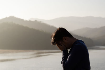 Asian miserable depressed man stand alone. depression and mental health concept.