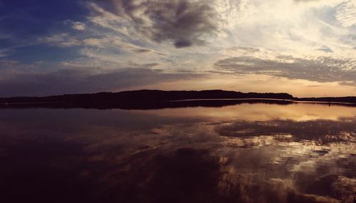 Scenic view of lake against sky during sunset