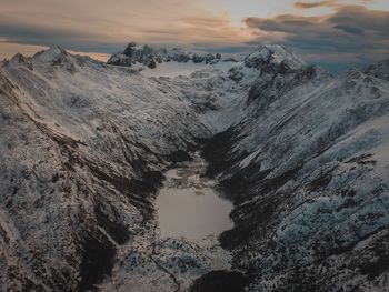 Scenic view of snowcapped mountains against sky during winter