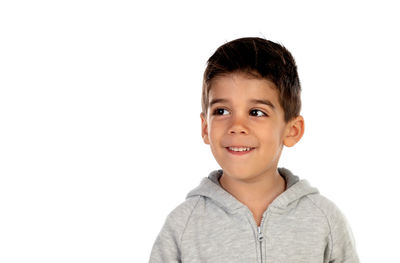 Portrait of smiling boy against white background