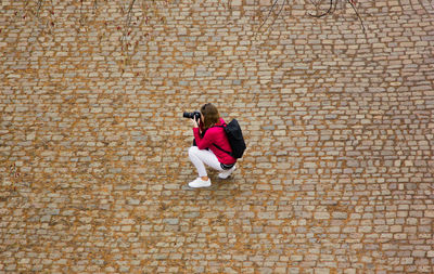 High angle view of woman photographing