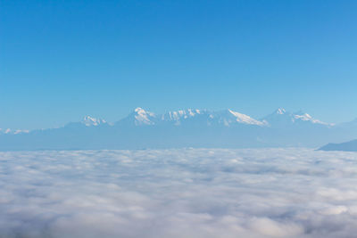 Scenic view of snowcapped mountains against sky