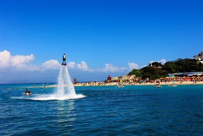 Scenic view of sea against blue sky