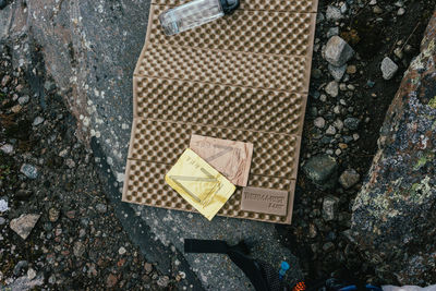 High angle view of water bottle on mat at ground