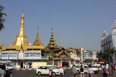 View of buildings in city against clear sky