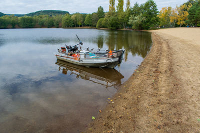 Boat moored in lake