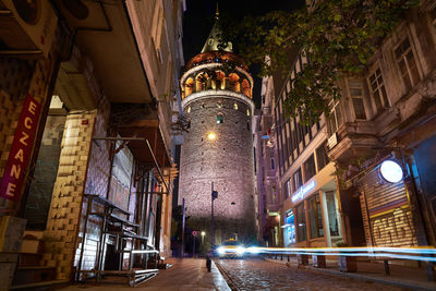 Low angle view of illuminated buildings at night