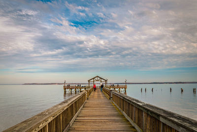 Pier over sea against sky