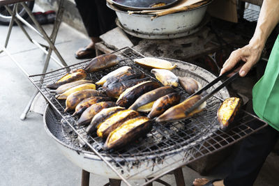 High angle view of meat cooking on barbecue