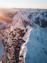 Aerial view of snowcapped mountains against sky