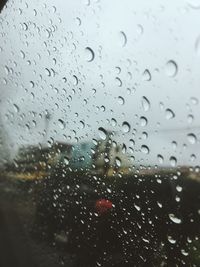 Full frame shot of wet glass window in rainy season