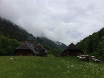 House on field against sky