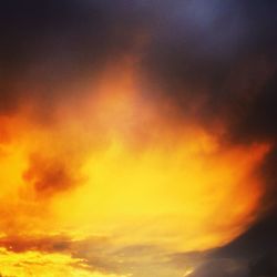 Low angle view of cloudy sky at sunset