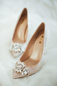 Close-up of bridal shoes dainty beautiful wedding high heels elegant details gemstone crystals