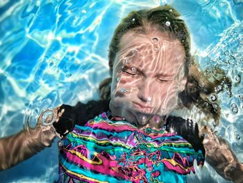 Portrait of woman swimming in sea