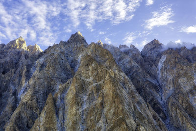 Low angle view of rock formations against sky