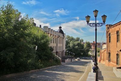 Street amidst buildings against sky