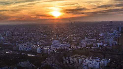 High angle view of city at sunset