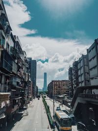 Panoramic view of city street against sky