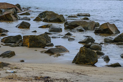 Rocks on shore at sea