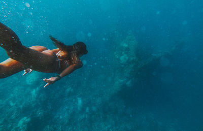 Woman swimming in sea