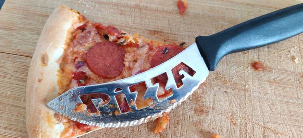 Close-up of pizza served on table