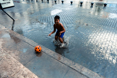 High angle view of children playing in swimming pool