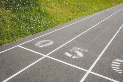 High angle view of arrow sign on road