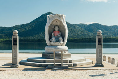 Buddhist monument at edge of lake usori, a scenic spot inside the osore-san bodai-ji temple in japan