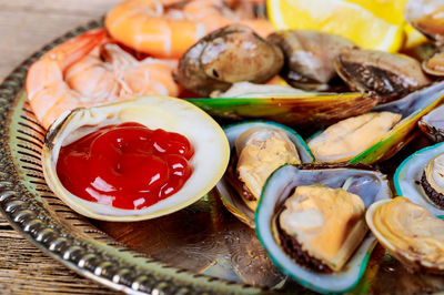 High angle view of fruits in plate on table