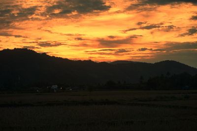 Scenic view of landscape against sky during sunset