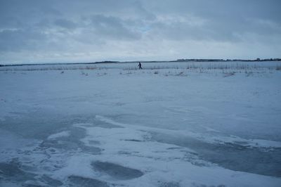 Scenic view of frozen lake against sky