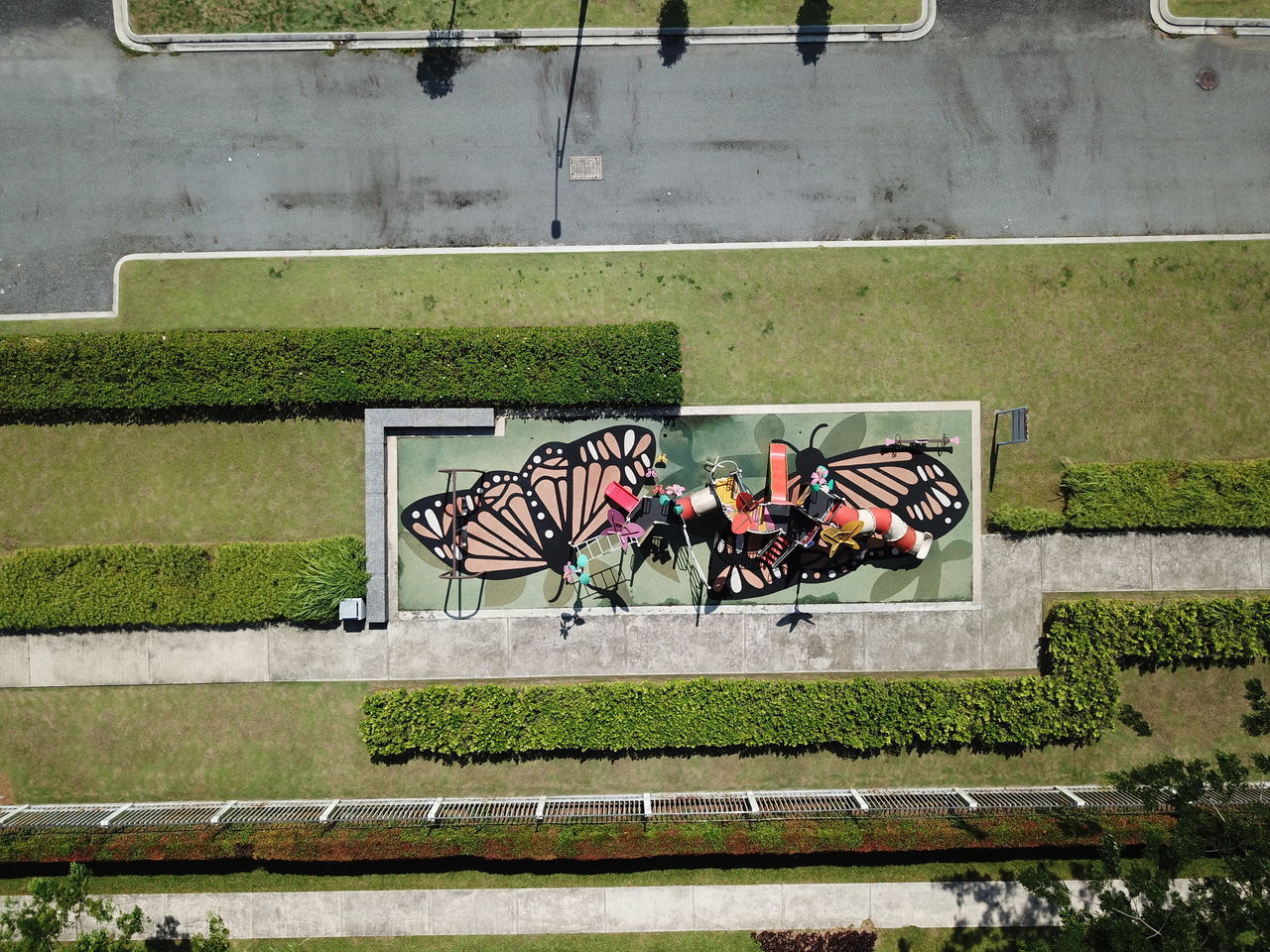 HIGH ANGLE VIEW OF PEOPLE SITTING ON BENCH