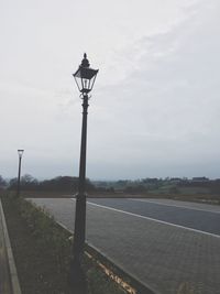 Street light against sky