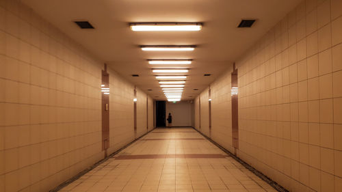 Illuminated corridor of building