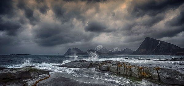 Panoramic shot of sea and rocks against sky