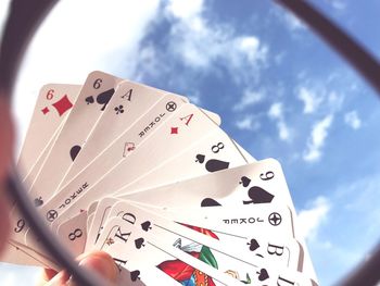 Low angle view of hand against the sky