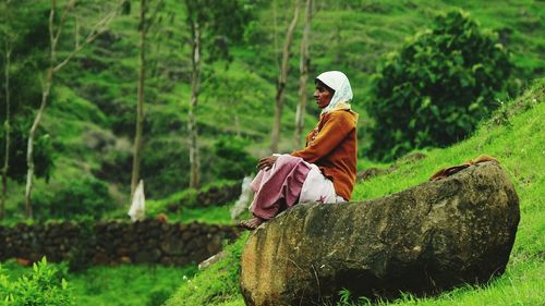 Full length of woman standing on grass