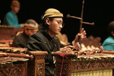 Portrait of man playing  gamelan