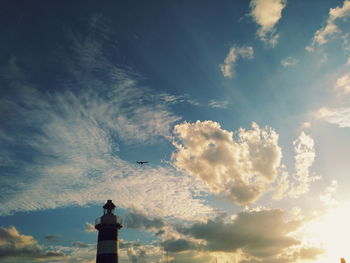 Low angle view of statue against sky during sunset