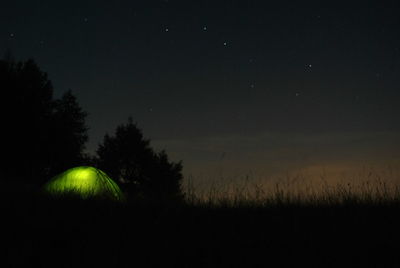 Scenic view of field against sky at night