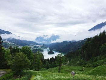 Scenic view of landscape and mountains against sky